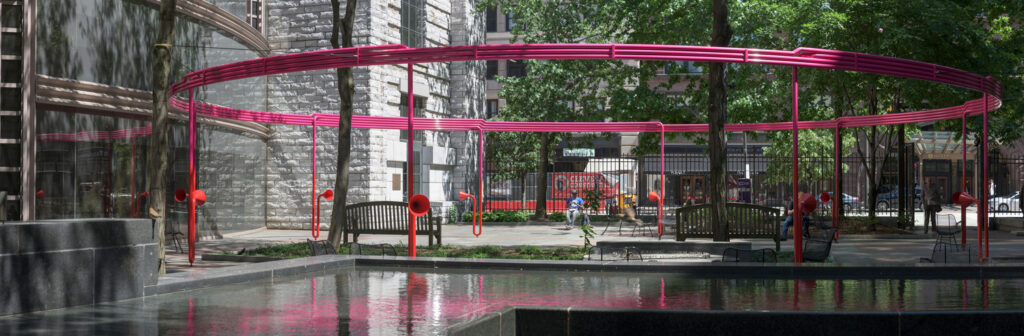 Large circular art structure of interlaced sound tubes