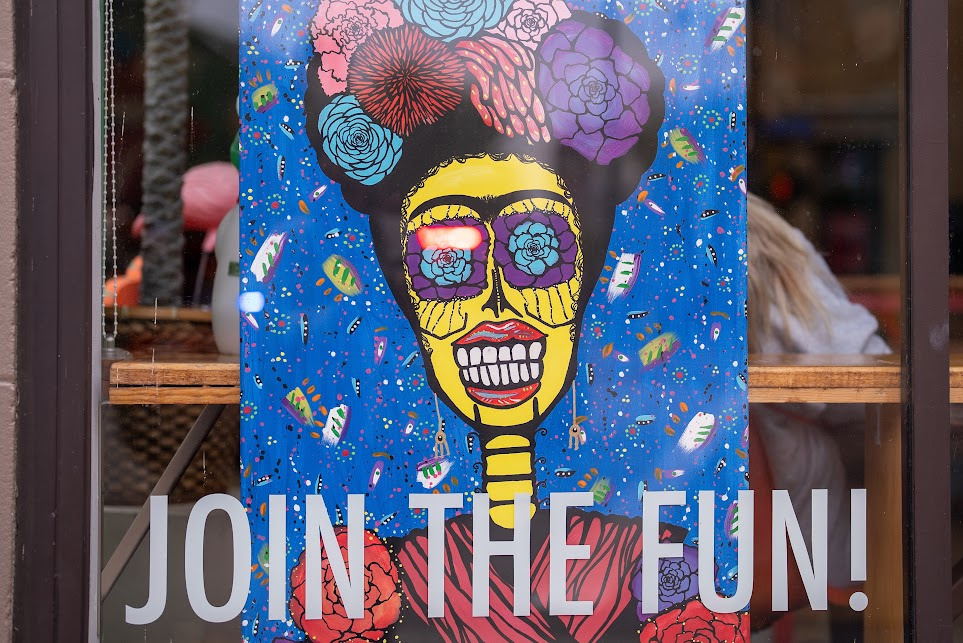 Día de Muertos painting. with "Join the Fun" on the door.