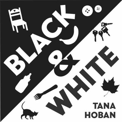 Black and White jacket cover with black and white text and simple object illustrations: a chair, a spoon, a cat.