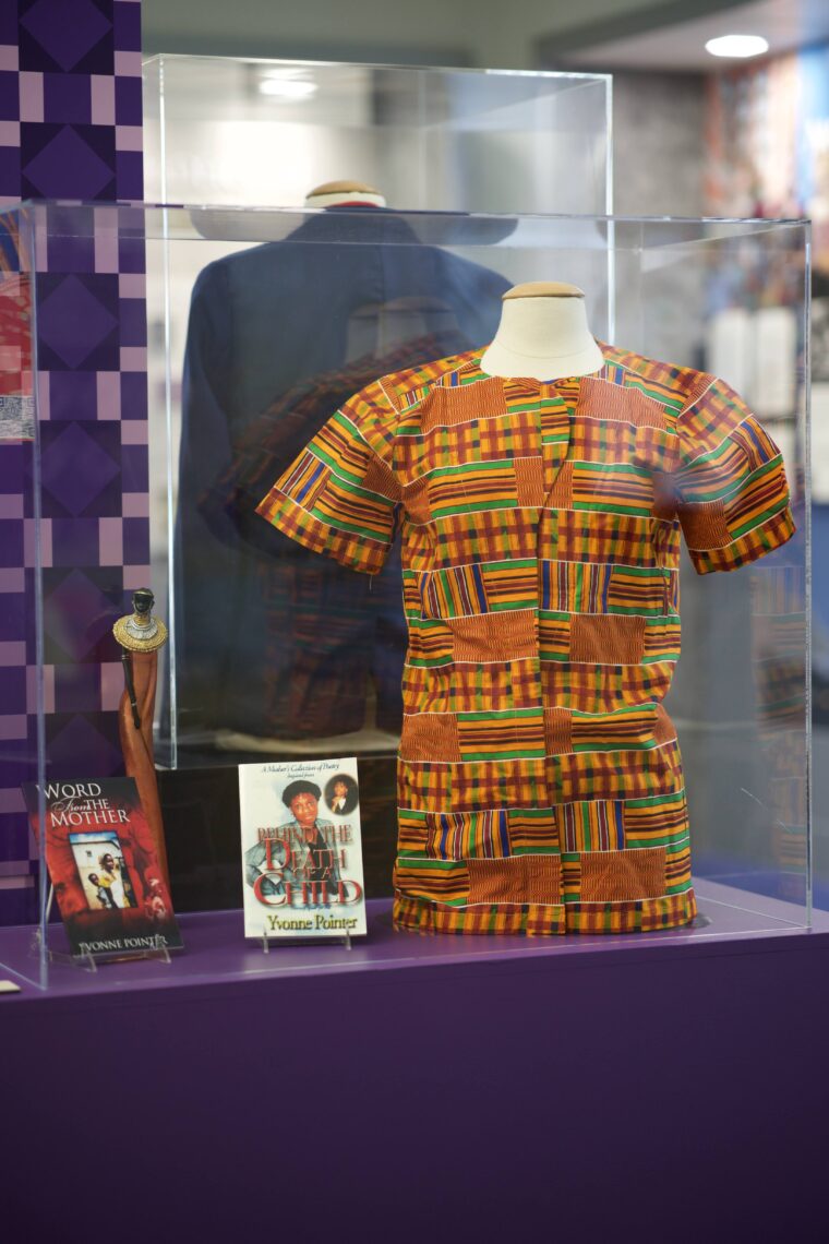 exhibit case with shirt with intricate pattern design