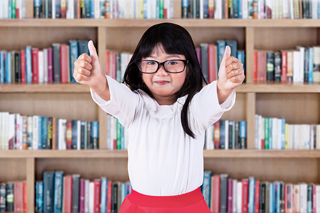 girl in front of library bookshelf