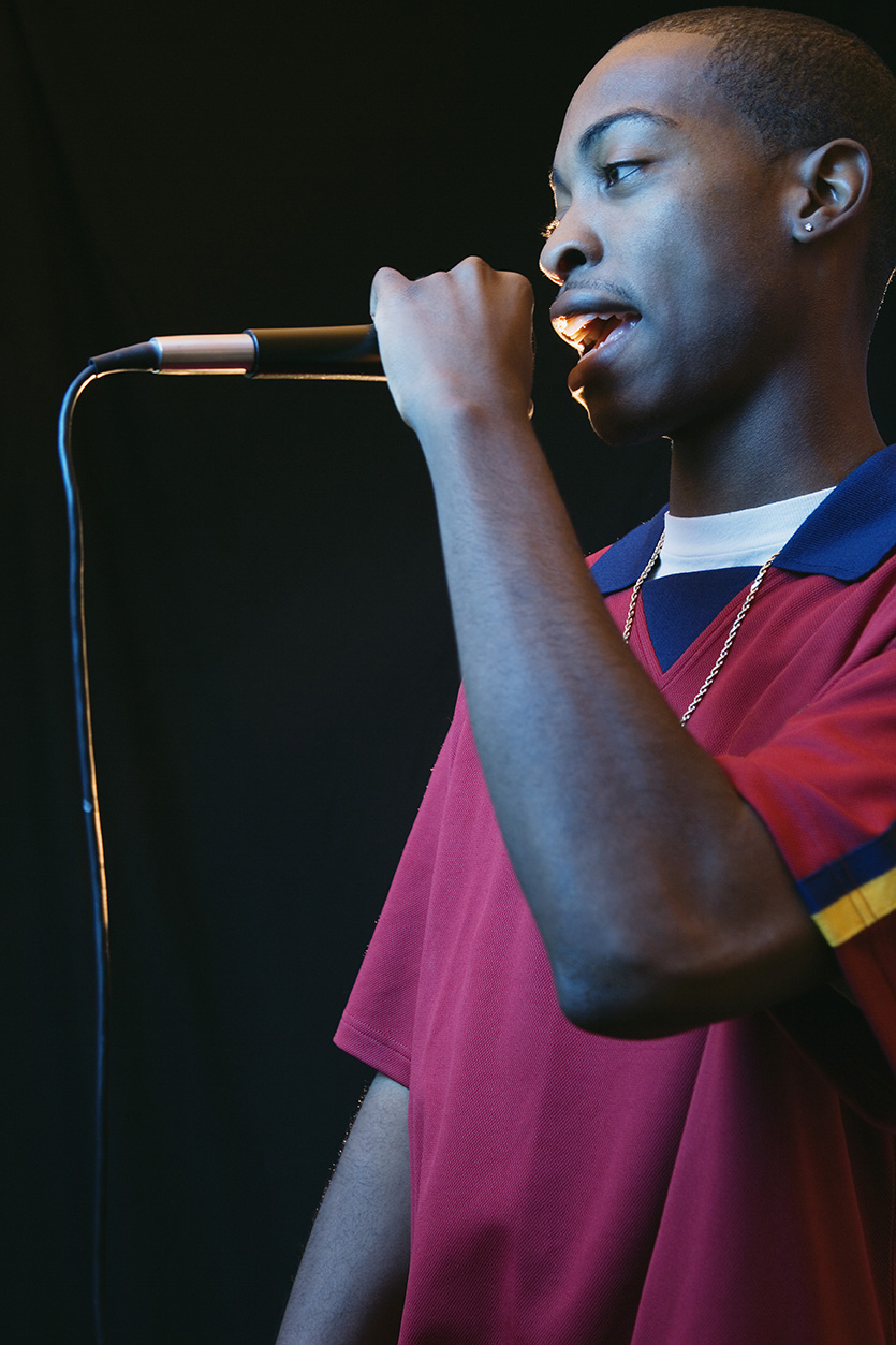 Young man speaking into a microphone