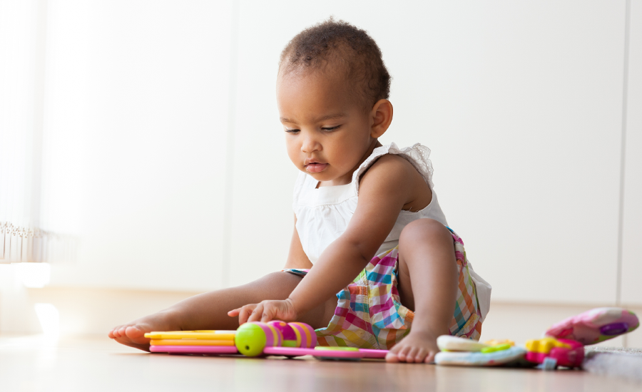 Baby with Colorful Plastic Book